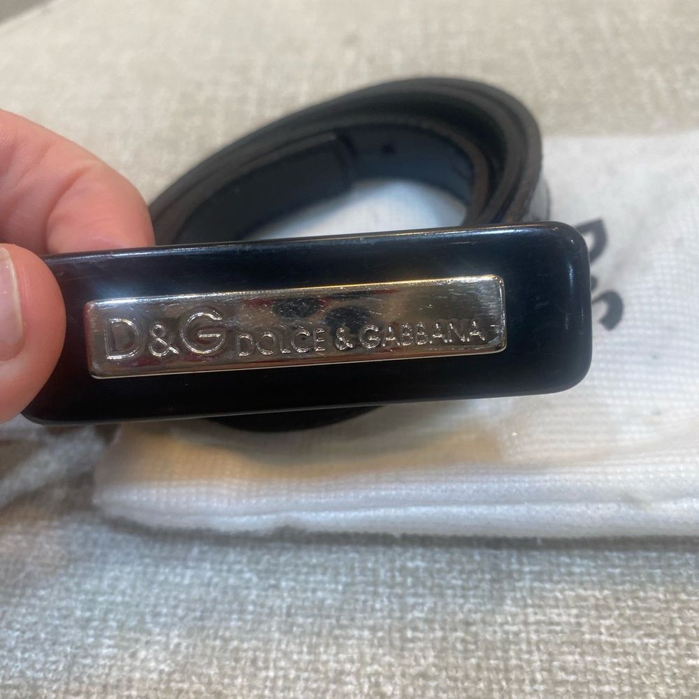 Authentic Dolce & Gabbana Black
Patent Leather belt with silver buckle